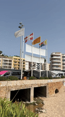 Blanes waterfront market and beach life on a summer morning