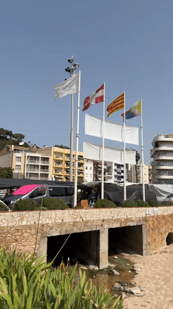 Blanes waterfront market and beach life on a summer morning
