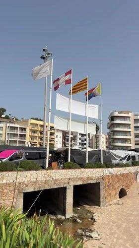 Blanes waterfront market and beach life on a summer morning