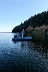 Fishing from an inflatable boat below Chaikovsky's riverside cliffs