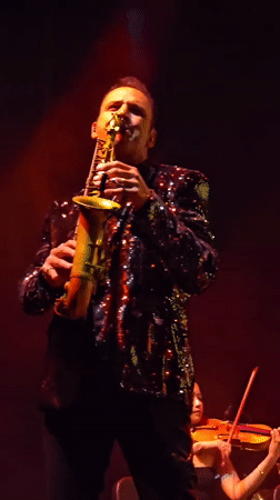 Late-night musical performance features singer and instrumentalists in Los Angeles