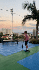 Scooter tricks on a Funchal rooftop at golden hour