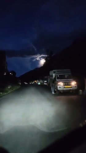 Moonlit night drive through mountain roads near Gondhla