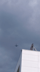 Woman displays race bib in Riga amid aircraft sighting