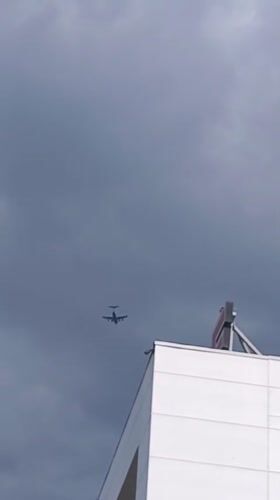 Woman displays race bib in Riga amid aircraft sighting