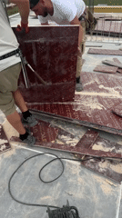 Construction worker cuts planks at Plovdiv building site