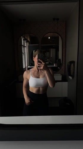 Woman takes fitness selfies in Ternopil bathroom