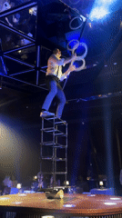 Street performer juggles and balances on tower in Dubai