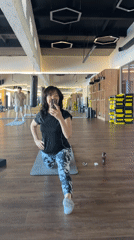 Woman takes selfie while stretching at Kokshetau gym