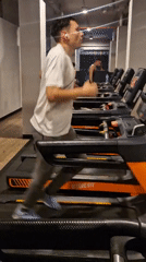 Man exercises on treadmill at Barcelona gym
