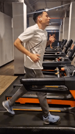 Man exercises on treadmill at Barcelona gym