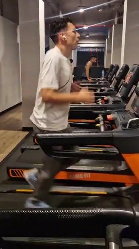 Man exercises on treadmill at Barcelona gym