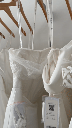 Wedding dresses displayed on rack captured in Los Angeles