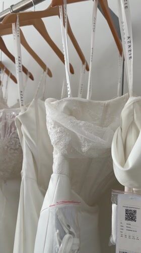Wedding dresses displayed on rack captured in Los Angeles