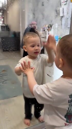 Toddlers engage in household activities in Rusanovo home