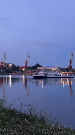 Cherepovets riverfront at dusk, quiet summer evening