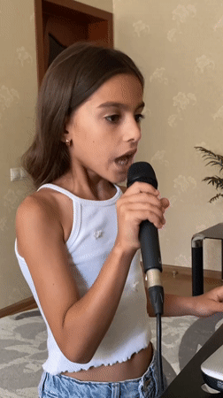 Indoor vocal performance at a mic in Gulkevichi, Russia