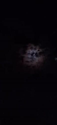 Crescent moon observed through clouds over Vallecito, Venezuela