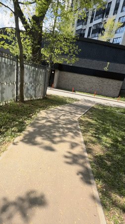 Woman takes selfies in Khimki park wearing noodle shop shirt