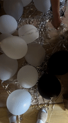 Person pops balloons amid food market activity in Ternopil