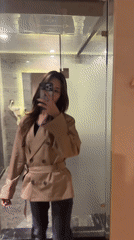 Woman takes mirror selfies in Ganzhou hotel room