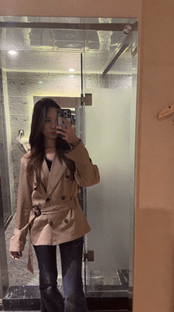 Woman takes mirror selfies in Ganzhou hotel room