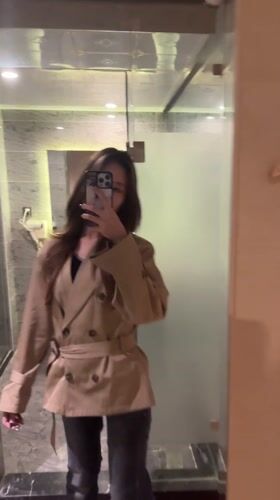 Woman takes mirror selfies in Ganzhou hotel room