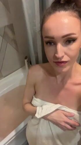 Woman enjoys candlelit bath in Kazan residential bathroom