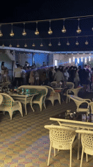 Busy outdoor nightlife spot lit up in Ақши, Kazakhstan