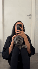 Woman takes early morning selfies with dog while watching tennis