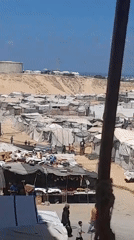Makeshift camp life in Khan Yunis, with a still moment close up