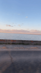 Sunset drive captured along waterfront near Chaikovsky, Russia