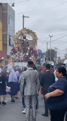 Ornate religious procession carries Christ statue through Callao streets
