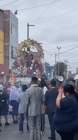 Ornate religious procession carries Christ statue through Callao streets