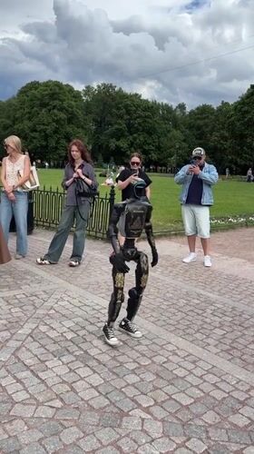 Gold-accented humanoid robot dances in Saint Petersburg park