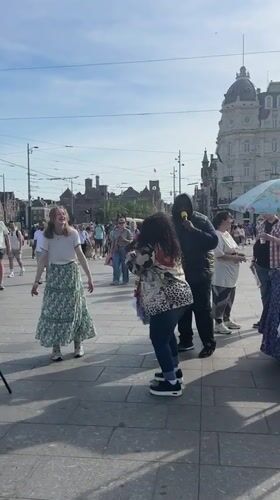 Amsterdam weekend afternoon: street performers, ice cream, shopping observed