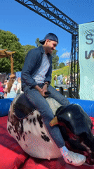 Mechanical bull riding draws crowd in Oslo afternoon