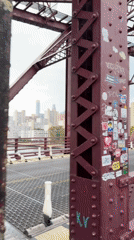 Bridge, ferry, and jet skis along the East River