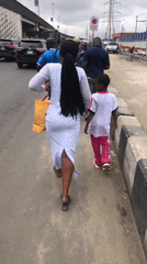 Everyday street activity along a busy Lagos corridor