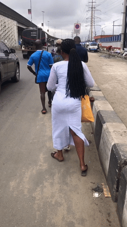 Everyday street activity along a busy Lagos corridor