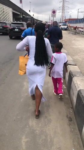 Everyday street activity along a busy Lagos corridor
