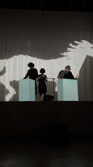 Live performance with cube props and projected visuals in Milan