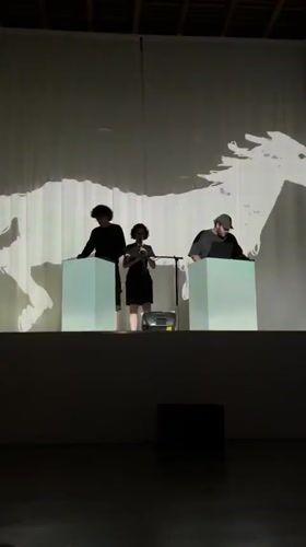 Live performance with cube props and projected visuals in Milan