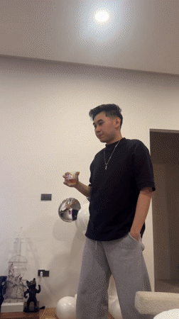 Man with drink observed indoors in Koh Samui