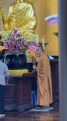 Monk performs early morning temple rituals in Da Lat