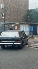 Person exits Ford wagon on London street