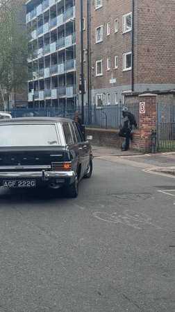 Person exits Ford wagon on London street