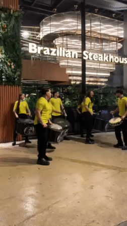 Street drummers perform outside restaurant in Tangier evening