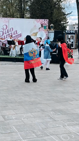 Women dance with Russian flag in Selivanovo public square