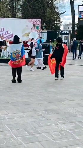 Women dance with Russian flag in Selivanovo public square